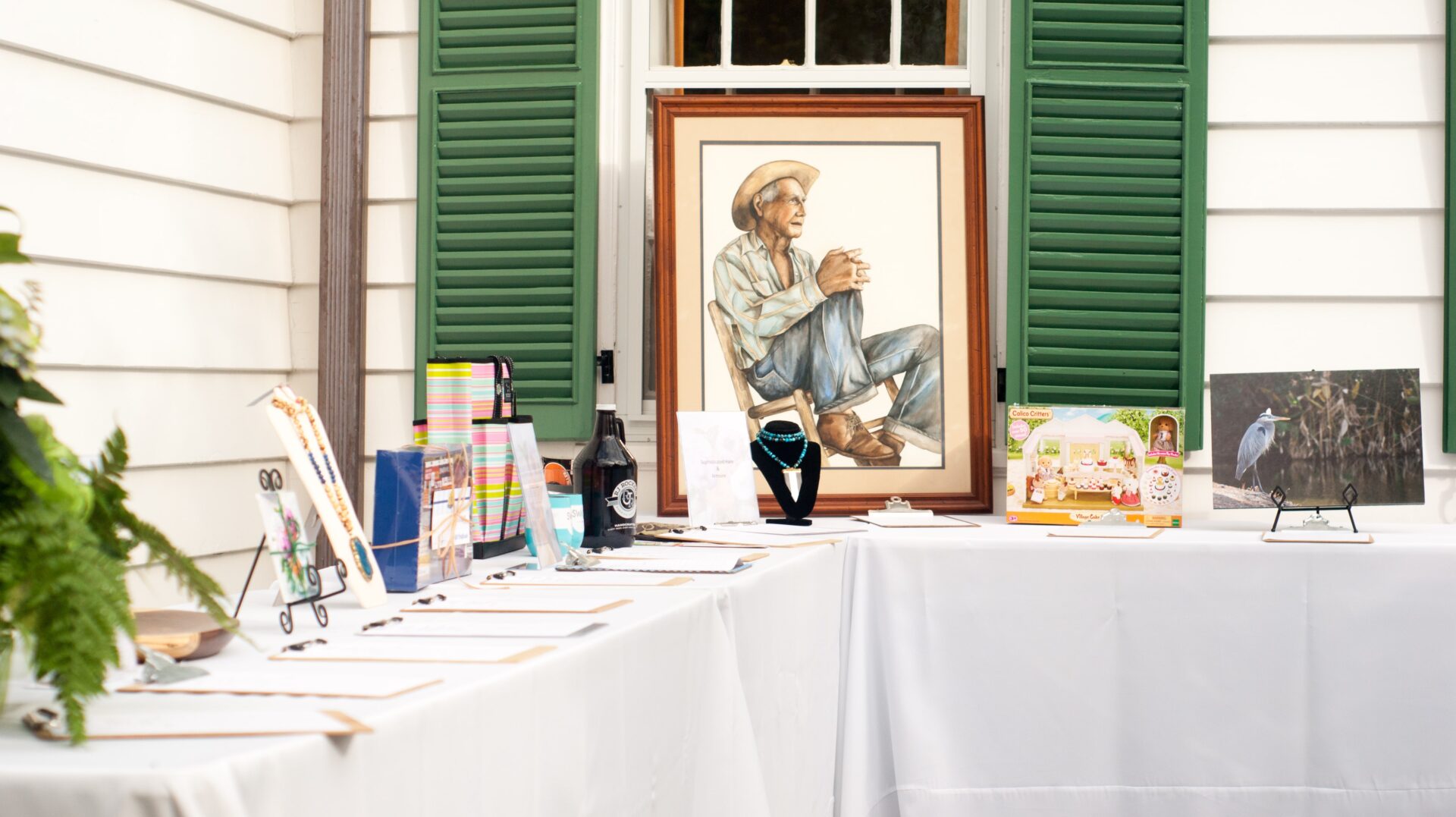 A table with books and an old picture on it