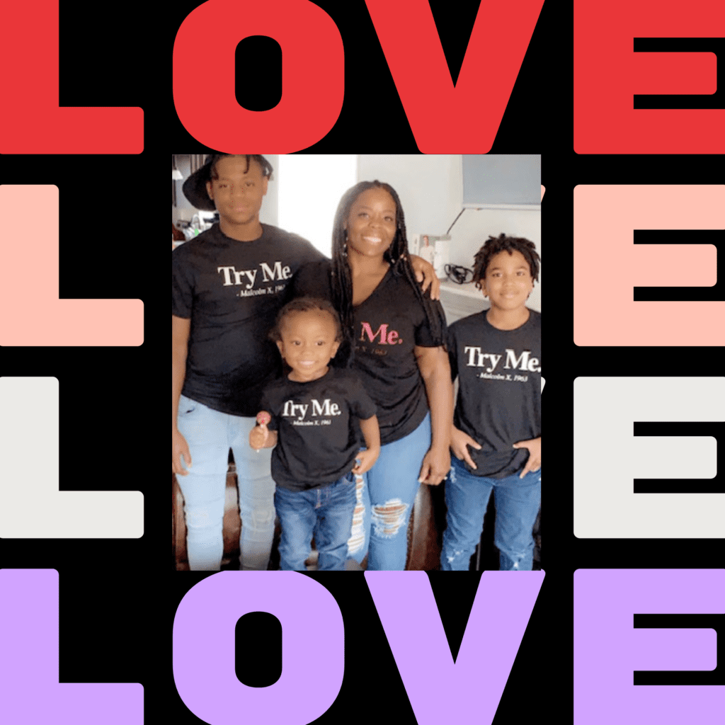 A family of four wearing black shirts with the word " love " on them.