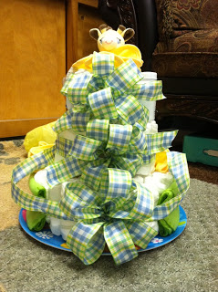 A cake made to look like a tree with ribbons.