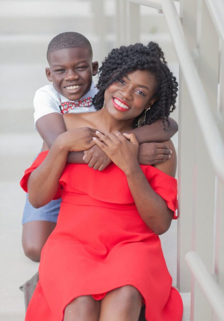 A woman and boy posing for the camera.